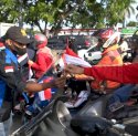 Tunjukkan Nasionalisme, Mahasiswa Asal Papua Bagikan 500 Bendara Merah Putih ke Pengendara 