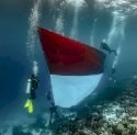 Rayakan HUT RI ke-80, Pertamina Gelar Pengibaran Bendera Bawah Laut di Wakatobi