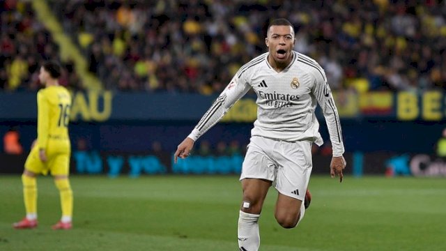 Kylian Mbappe berhasil mencetak dua gol, salah satunya lewat penalti panenka.  (Foto: REUTERS/Pablo Morano)
